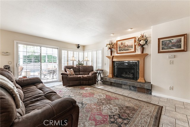 Family room with gas fireplace and wood mantle