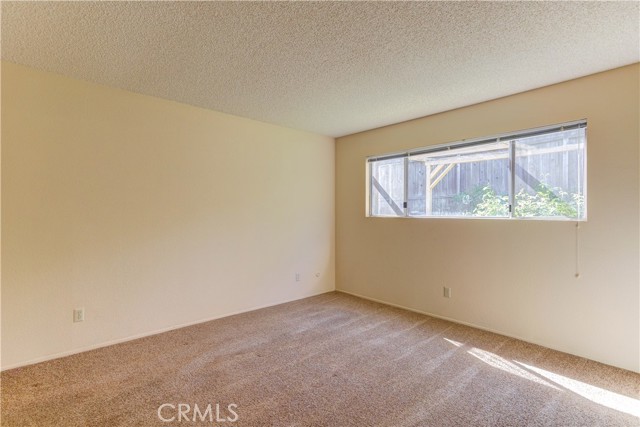 Primary bedroom located at the back of the home