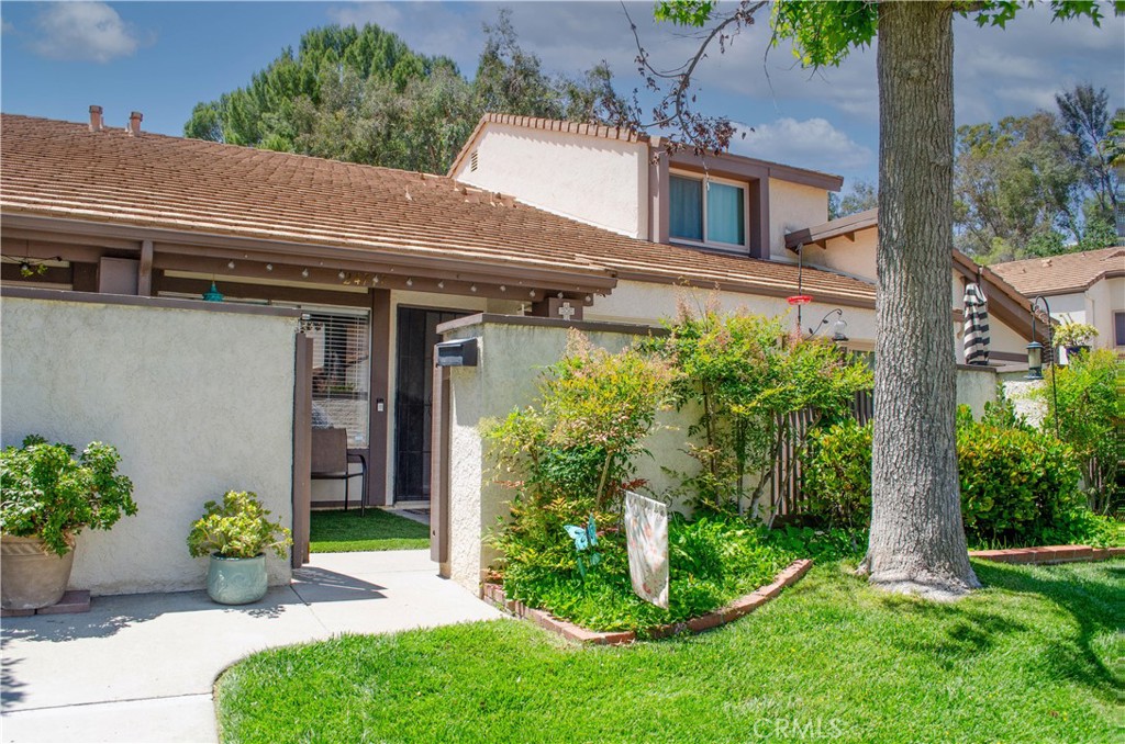This beautifully updated Valencia Fairways Townhome is a rare find. Tucked into the quiet side of the complex for added privacy, it is just around the corner from a sprawling greenbelt perfect for walks, play, or a breath of fresh air. Ideally located near the top-rated schools, shopping, dining, and easy freeway access, it offers the perfect blend of convenience and serenity. Inside, you'll find laminate wood flooring downstairs, plush carpet in the bedrooms, and beautiful wood cabinetry and granite countertops throughout the home. The kitchen opens to a cozy dining area with sliding glass doors that lead to a private patio with low-maintenance turf, ideal for relaxing or entertaining.
Upstairs, the bathroom features modern subway tile in the shower, and both bedrooms are spacious and bright. Enjoy peace of mind with a newer AC system and brand-new ductwork installed in 2023. The 2-car garage offers ample storage and houses the laundry area, making day-to-day living a breeze. The Valencia Fairways community is a true oasis featuring three pools, tennis courts, a playground, and lush landscaped grounds filled with mature trees and colorful flowers. Plus, you're just steps from the Vista Valencia Golf Course. This home is move-in ready and waiting for you. Don't miss out on the private, peaceful slice of Valencia living!