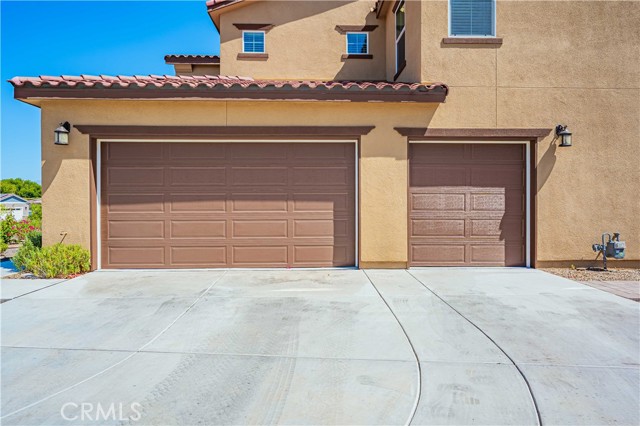 Side facing garage is acrtually 3 1/2 car wide with paid for $20k solar system, tankless water heater and drip sprinkler timer inside.