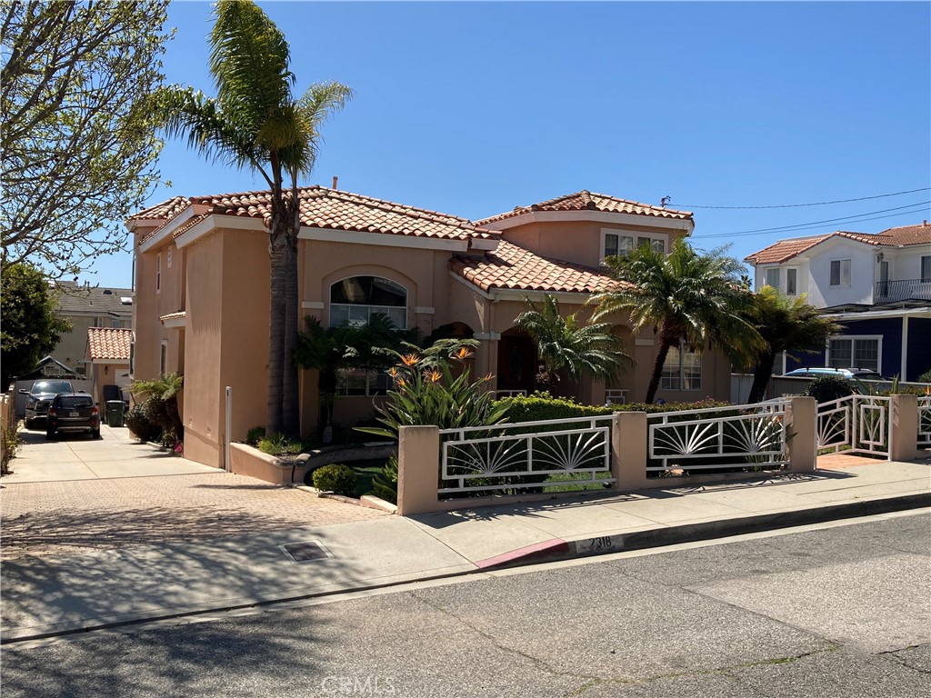 Mediterranean in style, full tiled roofs, Large Master Suite, 60' wide supersized lot at (9901 sq ft.) 165' feet in depth with a detached 2 1/2 car drive-through garage & Huge RV parking behind gates. Two patio's, two balconies, remodeled kitchen in 2018, newer heating, pex piping, 12' 9' 8' and vaulted ceilings. Huge open master in walk-in and master bath, two additional large rooms upstairs and plenty of storage. Fourth bedroom and office or 5th. bedroom downstairs. Double door entry, new carpets, wood flooring, kitchen tile that looks like wood, two pantry areas, washroom, laundry chute, large fireplace in family room, spa, two sheds, reinforced block walls 23 x 60 designed and submitted to city for a rear garage may or may not be buildable today? Seller may be willing to provide carryback financing to a highly qualified buyer/borrower.