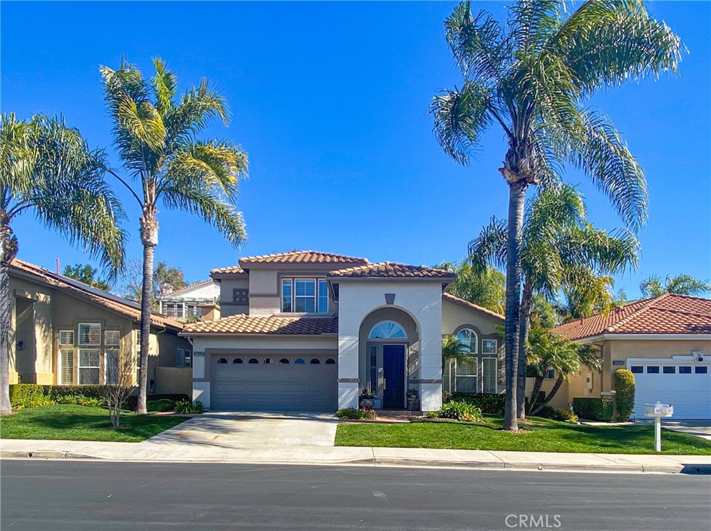 YOU HAVE FOUND YOUR TREASURE.....THE JEWEL OF PALMIA.  Enjoy living in the Prestigious "Heights" of Palmia, a highly sought after 55+ neighborhood located in Mission Viejo.  You will be taken in from the front yard with its majestic palms to the oversized private and entertaining backyard with the serene sound of the waterfall.  The front door opens to a new Wrought Iron Staircase, two-story ceilings to enjoy the natural lighting in this Spacious Open Floorplan offering Casual Living and Dining Room with Custom Shutters and Lighting.  Porcelain Wood Grain Tile thru-out. The Gourmet Kitchen is a Chef's Dream with its 9' Island, 8 gas burner stove, custom cabinets, under cabinet lighting, Quartz counters and Stainless Steel Appliances.  No expenses spared!  Cooking and Entertaining is made easy when overlooking the Family Room with a Customized Fireplace and Dry Bar overlooking the large entertaining backyard. Lower Level also provides the convenience of a Master Suite with direct access to backyard and a totally remodeled Master Bath including a New Vanity, Lighting, and walk-in Shower with bench seating and a heat lamp, dual shower heads and a walk-in closet with organizers.  Downstairs also offers a updated guest powder room and a inside laundry with upgraded cabinets.  The second floor with its luxury vinyl flooring thru-out including the staircase leads you to the large bonus room with custom built-in cabinets with drawers currently used as an office and sitting room.  Upgraded Bathroom with new vanity offering dual sinks, quartz counters, a mirror and lighting with glass enclosure tub/shower.  Two secondary bedrooms, One with a walk-in closet and the other a spacious guest bedroom with a balcony overlooking the entertaining backyard with a vegetable garden area and more. This 55+ Community boasts the best with NO MELLO/ROOS and its many amenities for residents and guest including Clubhouse, 18 hole putting green, billiards, tennis and sport courts, fitness room, poker room, library, classes and events thru-out the year.  Front yard landscaping and basic cox cable included in HOA dues.  Enjoy membership to Lake Mission Viejo, events, fishing and summer concerts and the  convenient location to dining, shopping, toll roads and freeways will all add to your enjoyment. You will feel like you are at a Palm Desert Resort without the heat as you enter our gated Prestigious Community "PALMIA" located in North Mission Viejo.