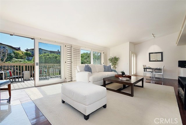 Family Room Opens to a Spacious Balcony Overlooking the Grassy Yard