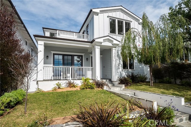 577 31st Street Manhattan Beach, California Beautiful, new Cape Cod home located on a charming tree lined gas lamp street. The large master suite in this home is a must-see with a vaulted beam ceiling, large walk-in closet with built-ins, private balcony with treetop views, your own mosaic pearl glass fireplace, and an amazing master bathroom that has a separate soaking tub and huge shower plus Carrara stone vanity. Enjoy streaming all of your favorite shows downstairs in the large basement media room or use the other bonus room in the basement as your own personal gym! The gourmet kitchen has stainless steel Thermador appliances, walk-in pantry, and large stone center island with bar seating. The Great room has a coffered ceiling, fireplace, sliding glass door opening to the front covered porch, and another set of doors that open to the grassy backyard with patio. This home offers ample parking with a 3-car garage and is in a great location of the tree section. It is close to the beach, shops, restaurants, Sand Dune Park, and award-winning Grandview Elementary School.