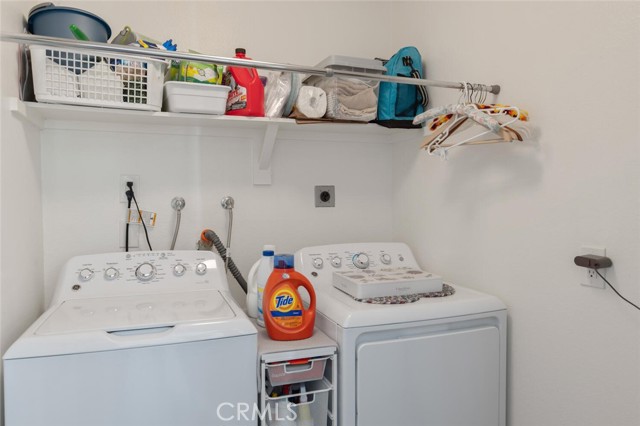 Private separate laundry room at this condo only a step away.