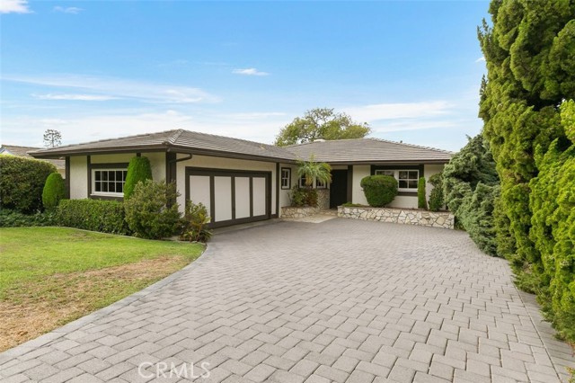 Interlocking driveway pavers; newer concrete tile roof in 2015.