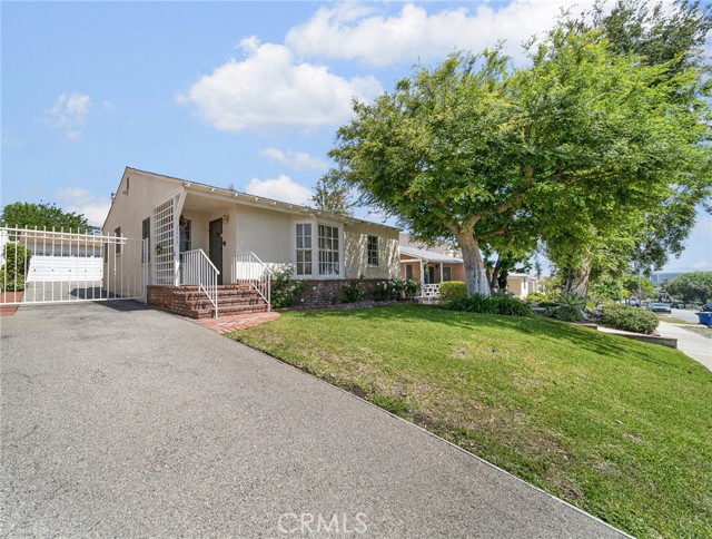 Here is the perfect "starter home" in one of the best locations in Burbank, and it's above Glenoaks! This is the first time it's been on the market in over 40 years, and you can tell this home has been lovingly cared for. The living room has a bay window with shutters looking out over the lovely neighborhood, there is a fireplace and formal dining room. The kitchen was updated with gorgeous oak cabinets, Corian counters and built in appliances, plus a laundry area. The three bedrooms share a full bath, and there is a 226 SF bonus room off the back of the house that would be a great home office, gym, or family room. The yard is beautifully landscaped with fruit trees and a patio, and there is a detached garage. Come make this one yours today!
