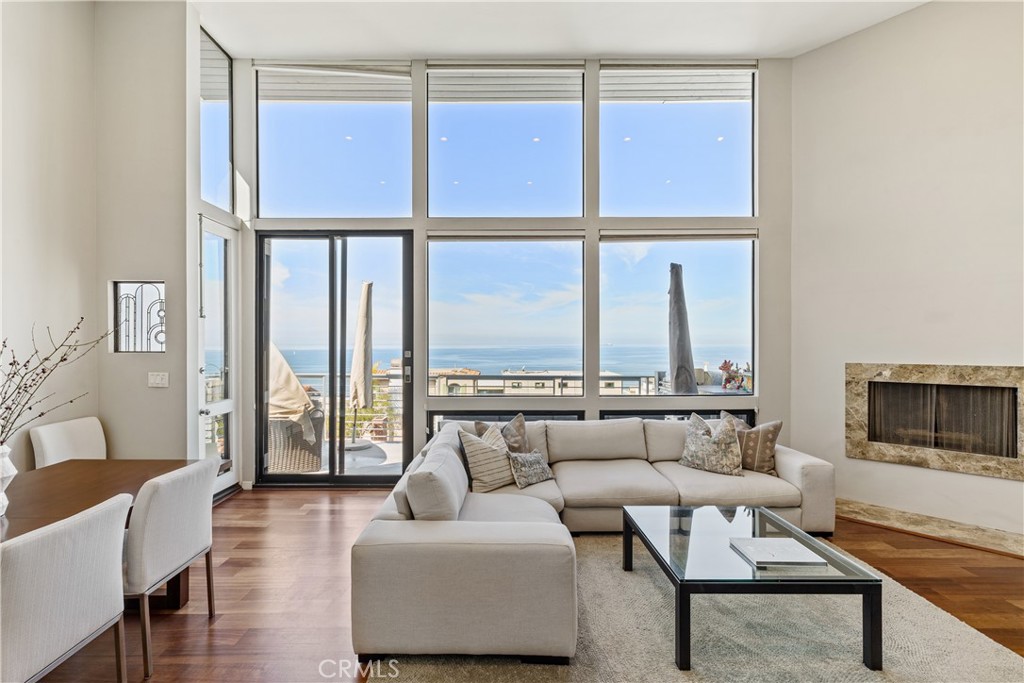 Wake up to the most spectacular view the South Bay has to offer. Just three blocks from the Manhattan Beach Strand, this contemporary multi-generational home, featuring the main residence + guest home boasts 180-degree ocean views of the Queen’s Necklace from PV to Malibu. As you enter through the front door and walk upstairs you see a bright, elevated, open living space with floor to ceiling windows showcasing these unobstructed panoramic ocean views.  All 3 levels of the contemporary home has ocean views, recessed lighting, large Fleetwood windows and newer appliances in the full-size kitchen. The charming front guest home offers a large sun filled back patio. 5 individual non-tandem garage parking for car aficionados. The Strand, the beach and some of the best surf in Southern California is just 3 blocks away, with award winning restaurants just around the corner. Don’t miss this opportunity, it may be the only one.