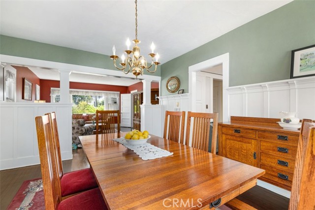 Dining room opening to formal living room & kitchen on right.