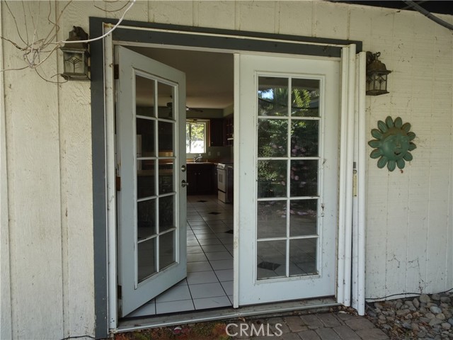 French doors off the kitchen area to the front porch.