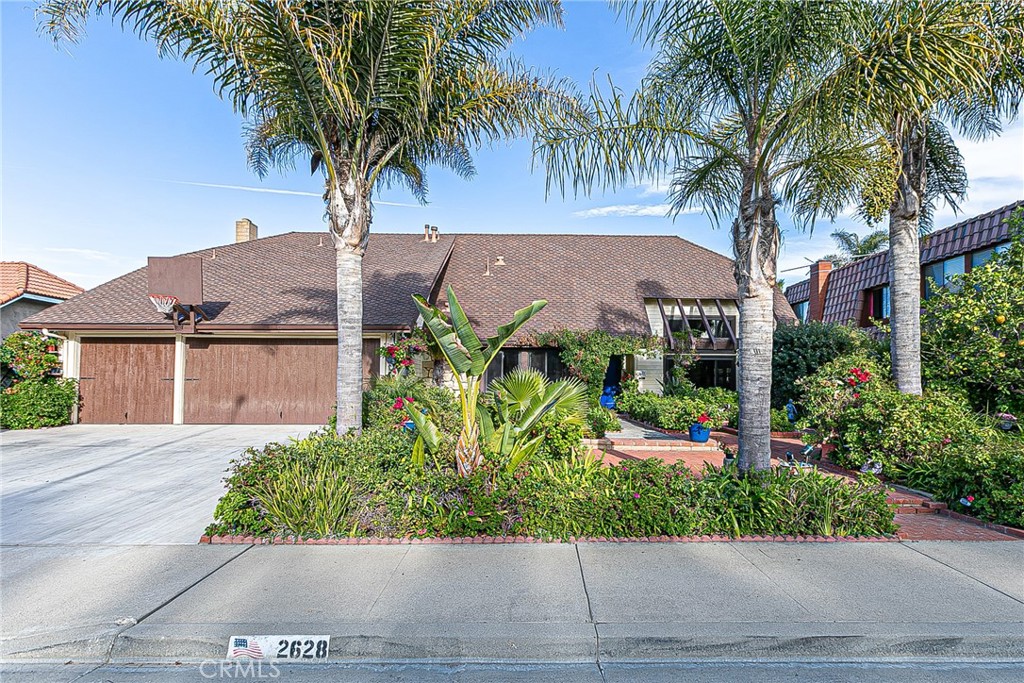 2628 Marlberry Street Santa Maria, California As you walk through its Double doors, your attention is captured by a lovely, spacious living room spanning the front to the back yard. Vaulted Ceilings with large upper windows allow an abundance of natural light. A large geometric orb encircles a crystal chandelier showering the room with prisms. Under the stairway lends the opportunity for a creative indoor water feature. Custom Mirrored wainscoting surrounds the elegant dining area. Charming Tuscan tiled Kitchen opens to a conversational family room with impressive European contoured ceilings, stone gas-fireplace, built-in snack-bar, and breakfast bar all promoting togetherness. Upstairs a romantic master suite with sitting area adjoins a master bathroom with ample counter space and Jacuzzi brand tub. Walk-in closets with built-in shelves for shoes, hats/handbags contribute to the quality of this living space. Spacious bedrooms with full bath and library-loft are ideal for families. 4th Bedroom opts for den/office. The beloved sunroom offers warmth and extra-entertaining space or for just relaxing. Garden views from every window. Fruit trees deliver warm orange blossom aroma in the backyard during spring. Open the front windows when the Jasmine is blooming and the house fills with its aroma! Quality flooring and great energy throughout. Wonderful memories start here!