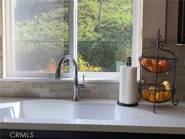 Quartz countertop, Elkay sink, pull out faucet, porcelain ledger backsplash - gorgeous AND durable!