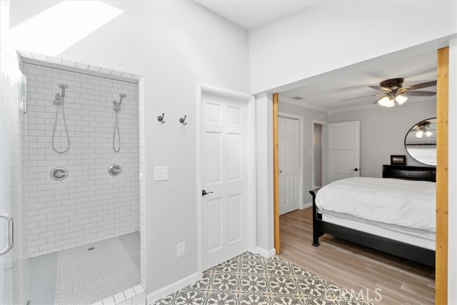 Note the dual shower heads in the spacious shower!