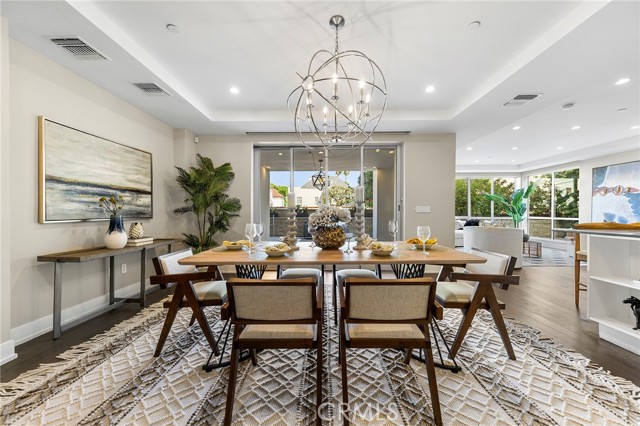Welcome to an extraordinary opportunity to own a modern gem in the heart of Beverly Hills. Nestled within the iconic 90210 zip code, this 2-bedroom, 2.5-bathroom condo is a prestigious offering from the renowned Beverly Hills developer, ETCO Homes, dating back to 2015. Boasting contemporary architecture and a lifestyle of unmatched sophistication, this property is a true testament to luxury living.

Spanning approximately 2,200 square feet of living space, this corner-unit condo offers an expansive open floor plan adorned with beautiful hardwood flooring throughout the living areas. Floor-to-ceiling windows seamlessly blend indoor and outdoor living, providing an abundance of natural light. Newly replaced carpeting adds an extra layer of elegance to this already remarkable space. 

The gourmet kitchen is a culinary paradise, featuring top-of-the-line Miele and Sub-Zero appliances, custom cabinetry, and a generously sized Caesar stone center island. The expansive master suite boasts a spacious walk-in closet and a modern spa-like bathroom equipped with dual sinks, a soaking tub, and two additional walk-in closets.

A standout feature of this condo is its expansive private wrap-around patio, ideal for outdoor dining and relaxation. Additional amenities include two side-by-side parking spaces complete with an electric charging station, a state-of-the-art fitness center, an elegant lounge, ample private storage, and round-the-clock concierge services.

Positioned just minutes away from world-renowned shopping and fine dining, this condo encapsulates the epitome of Beverly Hills living. Do not miss the chance to transform 460 Palm Drive into your dream home in the heart of Beverly Hills. The highly motivated seller invites you to bring in your offer today!