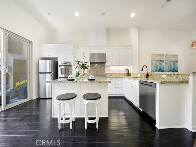 Modern and Bright open Kitchen with UV protected sliding glass doors