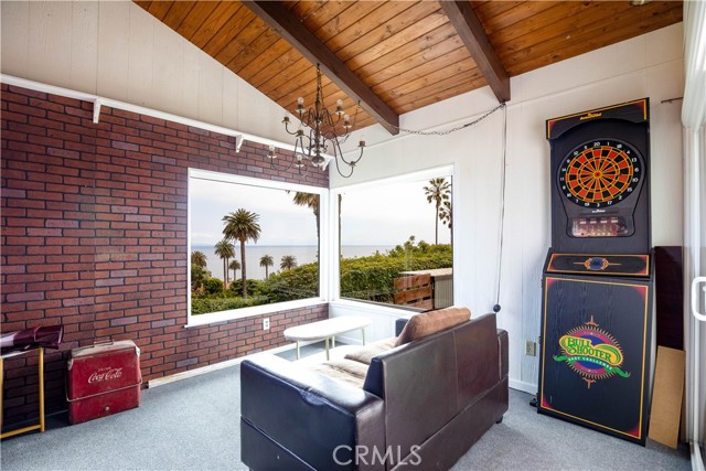 Vaulted ceilings and wet bar area in game room