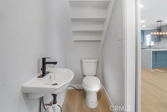 1/4 bathroom under stairway