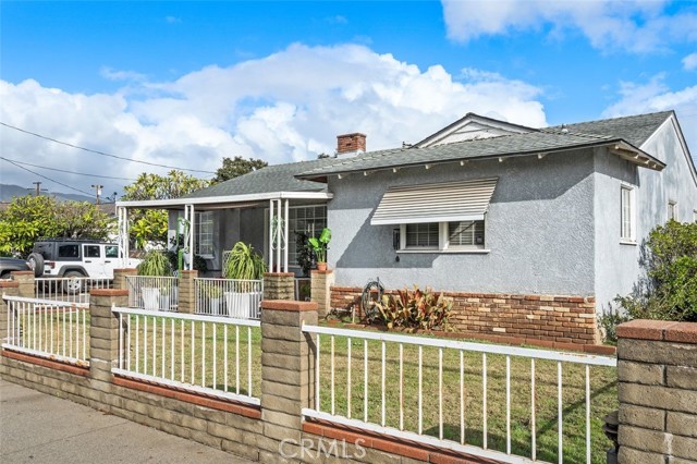 Quaint landscaping and 2-car garage welcome you.