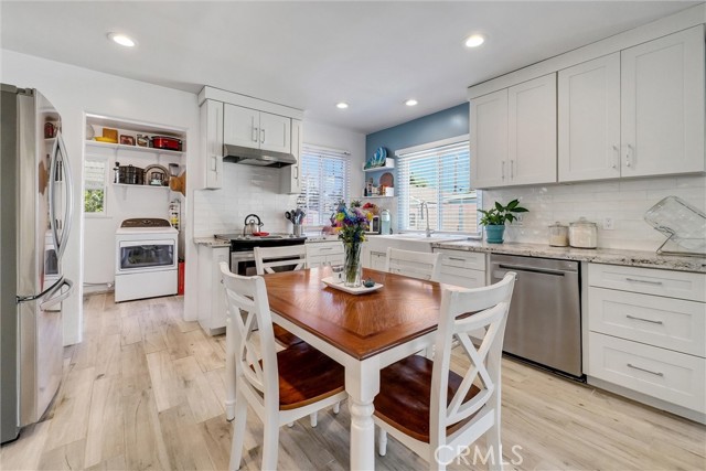  Kitchen & Eating area. Upgraded flooring. New Kitchen Cabinets, granite countertops, New Sink, New Stainless steel dishwasher,  stove, abd range. recessed lighting