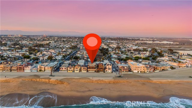 1421 Seal Way Seal Beach, California This Multifamily property offers Mid-Century Modern aesthetics and an iconic beach front location. A Triplex, the 3 bedroom, 5 bath larger two story primary residence's has floor to ceiling glass doors and clean lines, stone masonry and slate floors. Beach front. Watch the waves from the very tall rooftop deck with 360 degree views. Two ground floor units also face the beach front and have a shared walkout balcony. Expansive views of the Pacific Ocean, Catalina Island and the coastline. Ready to be restored or developed.