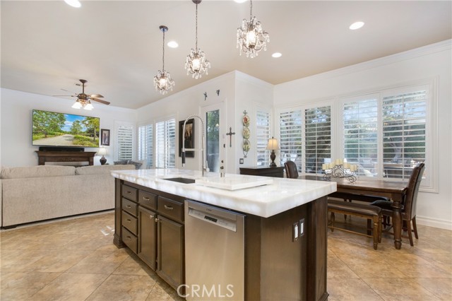 Kitchen is open to the large nook and family room with fireplace