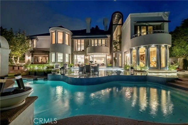2496 Lancelot Lane Bel Air, California Million Dollar Ocean Views, Million Dollar City Lights View, Million Dollar Bel Air Location with High Level Security and 24 Hour Guard Gated Community. This Beautiful Estate has had Over One Million Dollars spent in remodeling this home inside and out With Breathtaking Views and 5 Bedrooms That could be a 7 Bedroom and 6 Bath with minor changes to the office areas. Your guest are greeted by the amazing Koi pond located at the front door and tucked into the trees as you walk across a bridge walkway. As you enter this amazing estate you step into an incredible entry with soaring ceilings and dramatic architecture. Incredible views from the Kitchen, Dinning Room, Breakfast area, Family Room, Bar and Yoga area as well as Master Bedroom and Guest Bedroom balconies. Large Glass doors slide away to open the California indoor outdoor living at it’s finest. Unbelievable Estate for entertaining. Luxury Resort amenities in the home include Steam shower, saunas and swimming pool and outdoor sitting areas with Incredible views everywhere you sit to relax and enjoy! Guest can walk from the home to the large entertainers back yard and pool area, while the views from all of this is again Breathtaking! Many Luxury Resort Style Amenities from Community Pool, Gym, Yoga Room and indoor Workout Rooms with Showers and Saunas. Fire places throughout this Beautiful Estate to cozy next to with a glass of wine, a luxurious bar area in the formal living room and just off the family room. Outside we have multiple lighted Tennis Courts and Basketball Courts with a very private Playground area set in a beautiful pine tree grove area. You will enjoy the private golf practice course with Putting Greens and Chipping areas with Incredible canyon and neighborhood views. Walking paths allow you to stroll around the private neighborhood as you stroll through beautiful trees enjoying amazing views in complete security knowing that your private security guards are driving the neighborhood. This Extraordinary Estate has been recently and beautifully remodeled with over One Million Dollars of incredible marble, granite, white sparkle quartz, espresso custom cabinetry and Gourmet Entertainers Kitchen with Stainless Steel Viking appliances. Also recently remodeled is the private pool and pool equipment, large patio areas along with sitting areas and gazebo to enjoy the Views!!