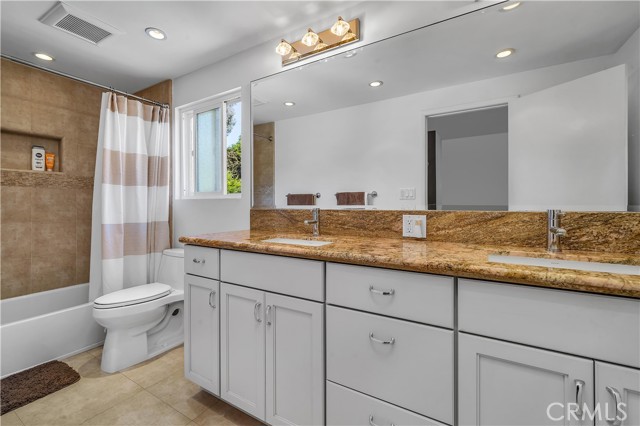 Large bathroom to accommodate the upstairs bedrooms with self-closing drawers, dual sinks