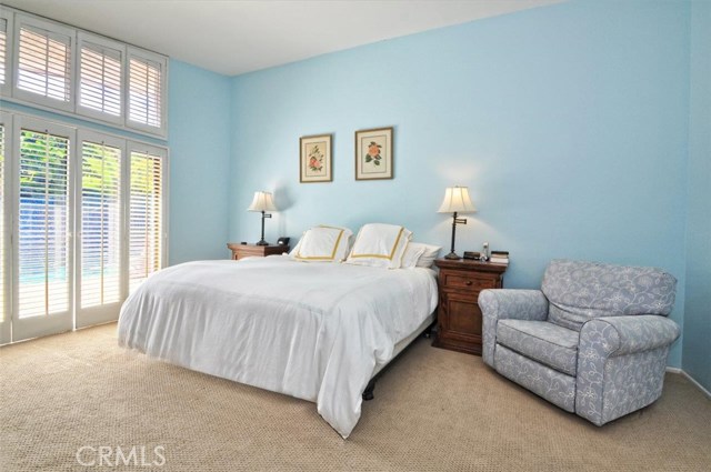 Master bedroom overlooking the outdoor living area