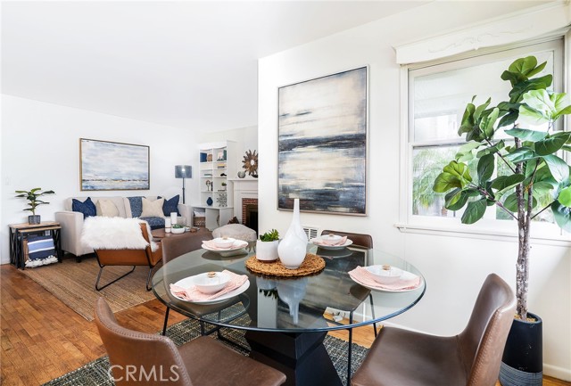 Dining room open to the living room with windows and sunlight all around!