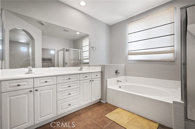 Master bathroom, featuring double sinks, and bathtub