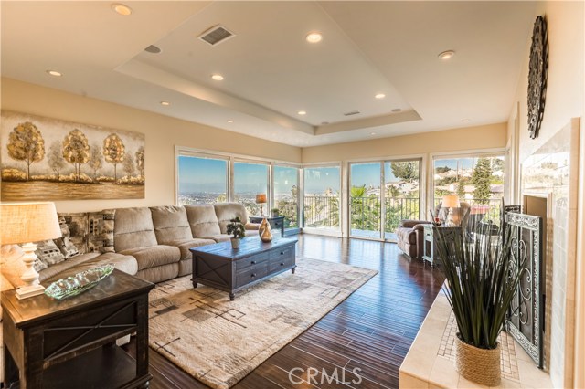 The living room is the ideal place to watch as the sparkling city lights begin to illuminate the night sky.