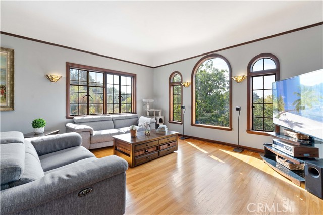 Spanish architecture throughout, Arched windows and hardwood floors.