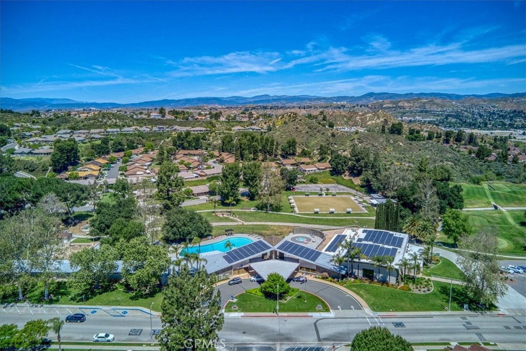 This spacious end unit is neat as a pin and ready for a new owner.  The enclosed patio offers extra square footage and there is a nice open patio area for that BBQ. The atrium area would make an ideal office.  The brick lined front porch adds a warm welcoming touch.  This SENIOR community is guard gated and patrolled 24/7 which gives a welcome sense of security. There are all the usual country club amenities including an executive golf course and  an eighteen hole pitch and putt course.  There are many activities for those who wish to be involved.  An RV parking lot is a big plus and the community church is welcome to all.