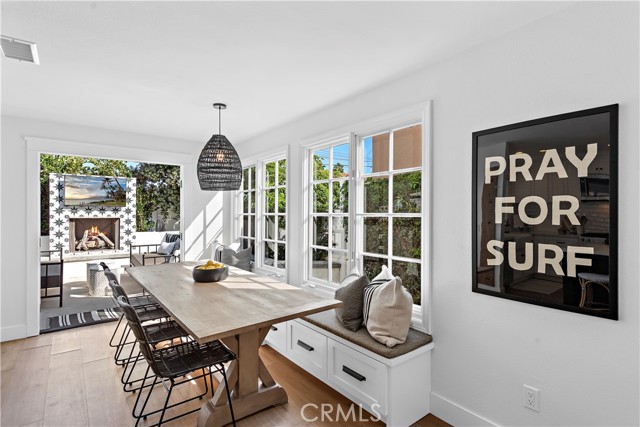 Dining area with built-in seating bench and storage.