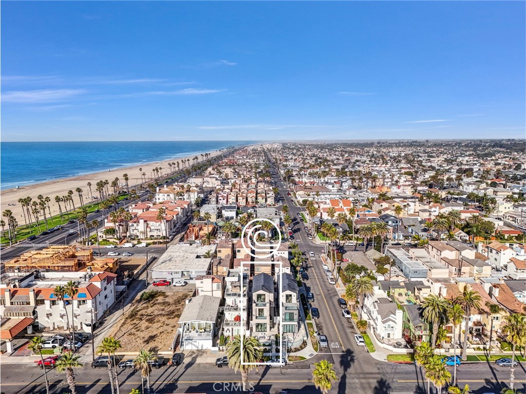 Welcome to 125 8th Street – where modern luxury meets coastal elegance. This newly constructed three-story masterpiece in the heart of downtown Huntington Beach boasts rare ocean views, a private elevator, and higher than street level elevations, rarely seen from common residences.

The home features: 3 bedrooms + large loft (optional 4th bedroom), 3.5 baths, gorgeous 48”x 48” marble designed tile flooring, beautiful wide plank engineered wood flooring, security system, tankless water heater, large laundry room with sink, soaring 10-foot ceilings on the main level, high end interior finishes.

The main level’s great room is accentuated by stunning bi-fold doors, effortlessly merging indoor and outdoor spaces for the ultimate beachside experience, year-round. The gourmet kitchen, adorned with stainless steel appliances and generously-sized quartz island stands as a focal point, blending functionality and elegance seamlessly. The secondary rooms, loft and laundry are on the second floor.

The luxurious master retreat, on the third floor, has its own elevator access, a sitting area with a private balcony that enjoys ocean views, a custom walk-in closet, and spa-like bathroom featuring large shower, soaking tub and his and hers vanity.

Two expansive balconies embrace the rays of sunrise while the large rooftop deck unveil awe-inspiring sunsets with ample space to have a BBQ and spa.

This luxury property offers not only breathtaking views but also the perfect beach lifestyle, with proximity to Pacific City, Huntington Beach Pier, shopping, dining and steps from PCH, convenience and leisure is at your doorstep. Don’t wait to experience the ultimate in beachfront luxury living at 125 8th Street, contact us today to schedule a private tour.