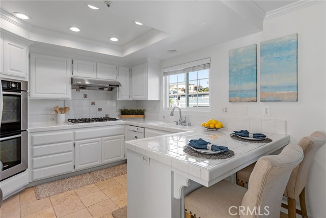 A cook's dream w/double oven and open kitchen.