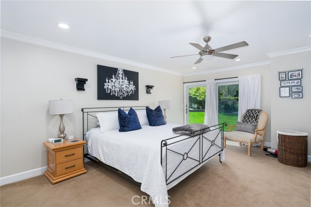 Primary bedroom sliding glass doors to backyard