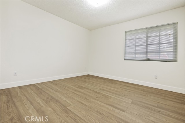 Secondary bedroom with mirrored wardrobe closet doors