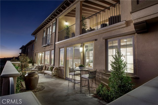 Nice patio for entertaining or enjoying a cup of coffee. Photos are of the model home, current home is under construction. Nice patio for entertaining or enjoying a cup of coffee. Photos are of the model home, current home is under construction.