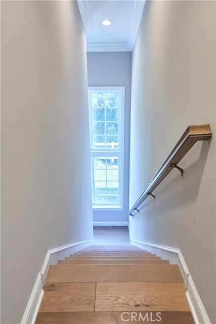 Back stairwell leading to upstairs loft/den and upstairs bedrooms