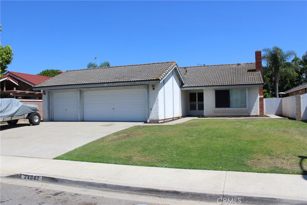 Great opportunity for someone who wants large pool size lot and plenty of places to have cars and trailers. 3 Bedrooms, 2 Baths, and a 3 car garage with a pass through garage door into a side area for extra vehicles or a trailer. The rear yard has a huge patio and fruit trees, block wall fences, and a large storage shed on the side yard. Tile flooring in the living room, country kitchen, dining area, laundry room, and hallways. The kitchen has newer cabinets and granite counters and the bathrooms have newer vanities and the master shower has been redone. The property also has inside laundry, tile roof, bedrooms have scraped ceilings, and the garage has been drywalled & insulated, pass through garage door, and a large attic storage space has been built. No HOA dues and no Mello-Roos.
