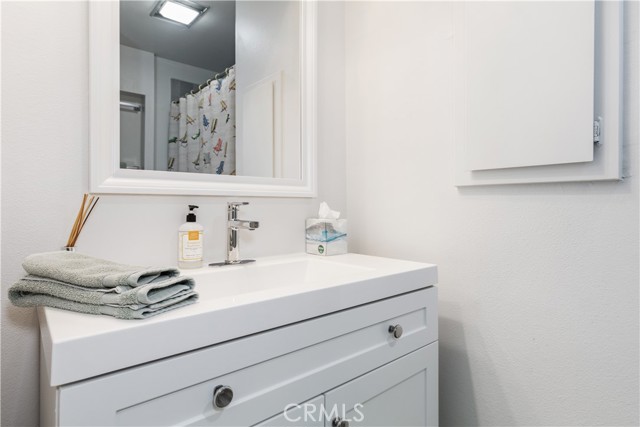 Hall bath with recently renovated shower/tub combo.