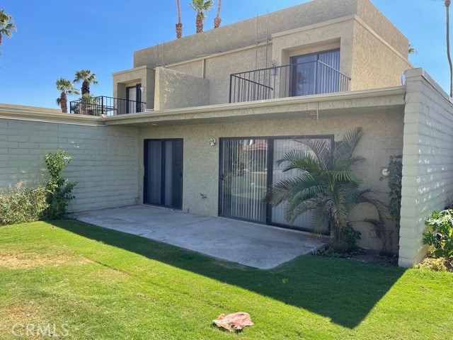 Amazing opportunity to own a townhouse style home located within the gated Cathedral Canyon Country Club! You will love the Spacious living room with a wall of windows to the patio and landscaped grounds. There are two upstairs master bedrooms, an additional patio upstairs, and inside laundry! Direct access to your own 2 car garage and lots of additional storage. Located near one of the community pools! This is a perfect purchase as your second home, a great rental, or full-time residence! Cathedral Canyon Country Club offers 10 tennis courts, 18-hole golf course, JAX Restaurant, and ample pool/spa areas (buyer to verify membership requirements and call hoa directly). Live every day like you are on vacation! Located only minutes from Palm Springs International airport, shopping, fine eateries & entertainment! Take a tour and make an offer today!