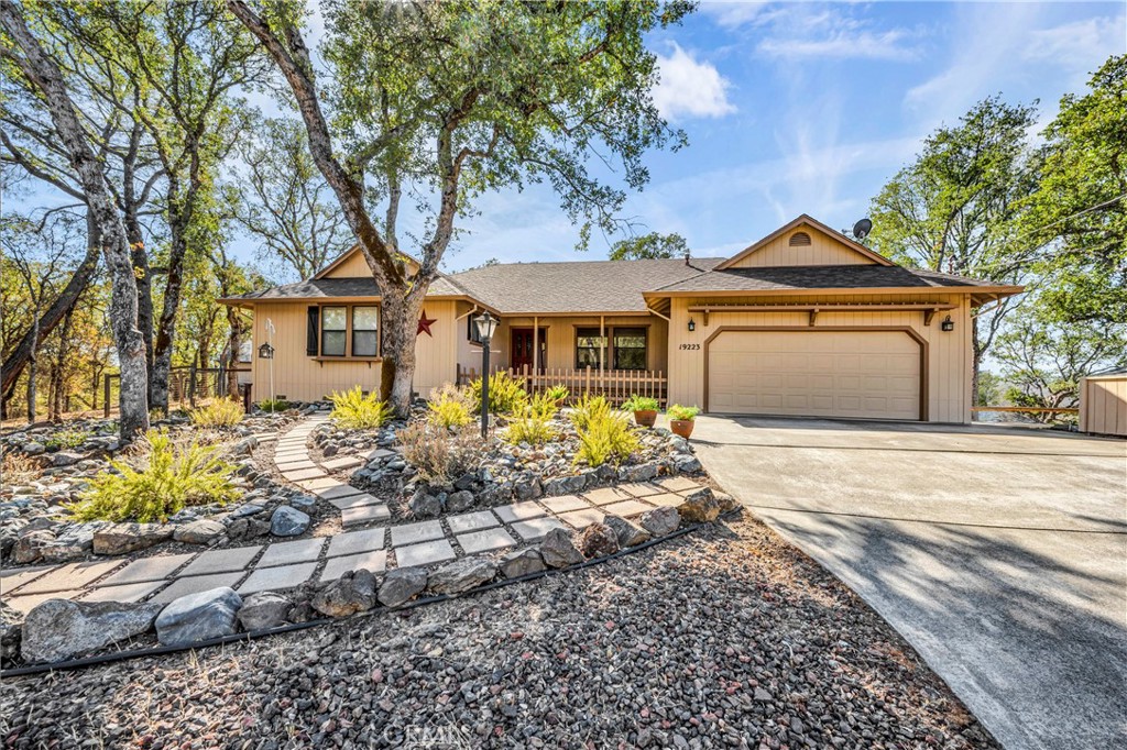 Private Setting amongst the trees with views of Mt. St. Helena in the distance at this 3 bed / 2 bath home with 1,796 SF + workshop in beautiful Hidden Valley Lake! Lovely curb appeal and pride of ownership shines from the moment you arrive. Freshly maintained paint on the exterior & newer roof! Inside find a formal entry with large family room that flows into the formal dining room and updated kitchen. You will love all of the storage opportunities with plenty of cabinetry and counter space including a breakfast bar for additional dining. Electric range, microwave, dishwasher and refrigerator are all included! The living room off the kitchen offers vaulted ceilings with a ceiling fan, propane stove and access to the covered back deck where you can take in the views. Down the hall find 2 comfortably sized bedrooms with ceiling fans and an indoor laundry suite that is sure to please. The primary offers a large closet and ensuite bathroom with walk-in shower. Under the home is a large workshop area which also provides access to the crawl space. Meander the pathways throughout the yard or relax on one of the 2 covered porches. This private sanctuary could be yours- schedule your viewing today!