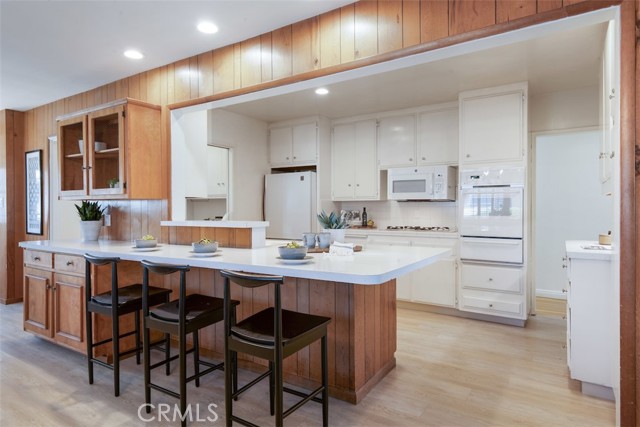Large peninsula/island seamlessly blends the kitchen and family room.