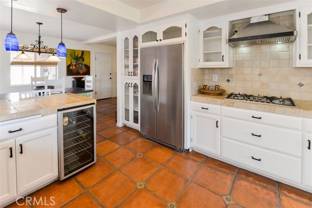 View of the wine cooler and the breakfast nook beyond the counter.