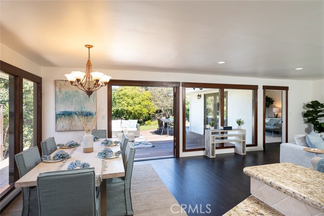 Open floor plan with floor to ceiling windows overlooking the private yard.