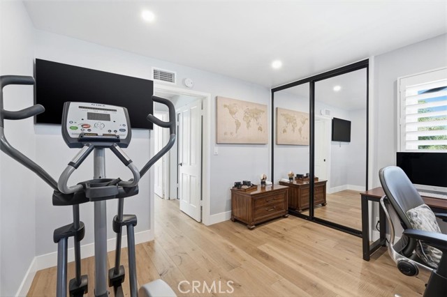 secondary bedroom used as an office with renovated closets