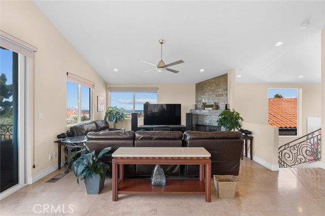 Spacious living area with fireplace.