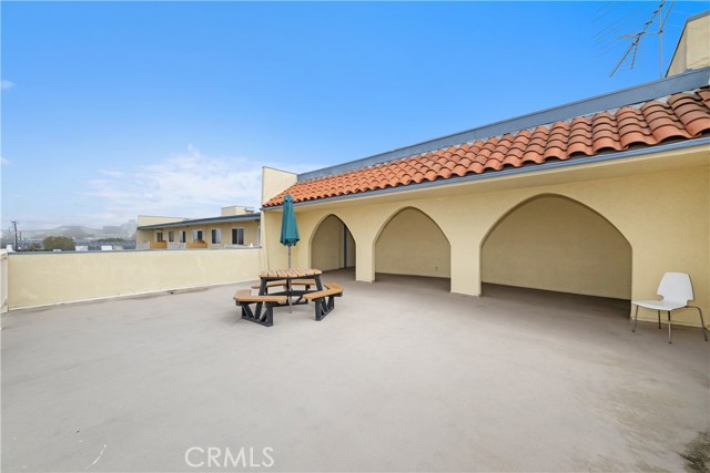 front door to unit is under first arch